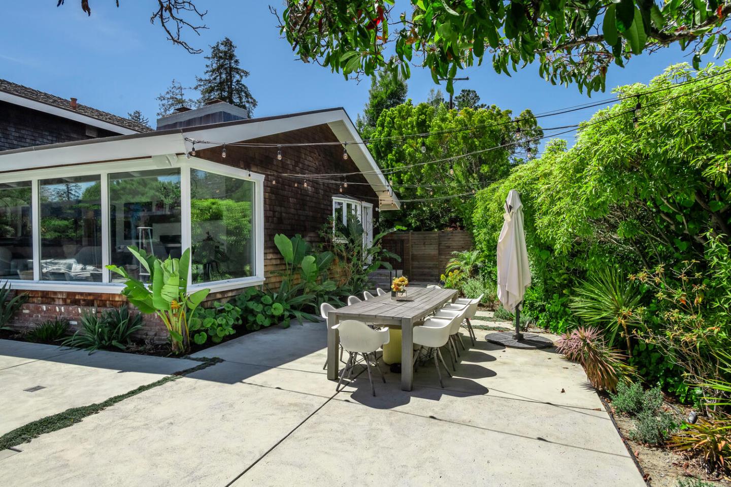 2651 Summit Drive Burlingame, CA 94010 - Photo 29 of 34 a view of a chair and table in backyard of the house