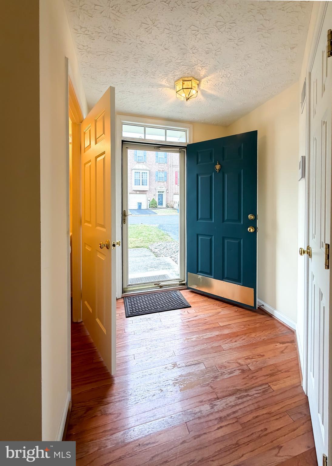 9708 Redwing Drive, Unit 9708 Perry Hall, MD 21128 - Photo 4 of 40 a view of hallway with wooden floor