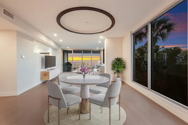 a large kitchen with stainless steel appliances granite countertop a large counter top a stove and a refrigerator