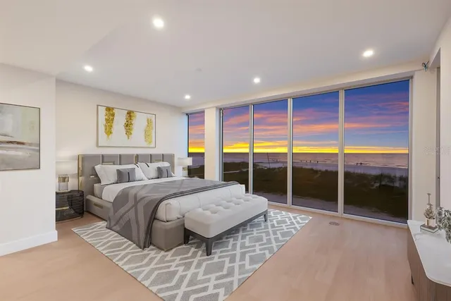 a bathroom with a glass shower door and a sink