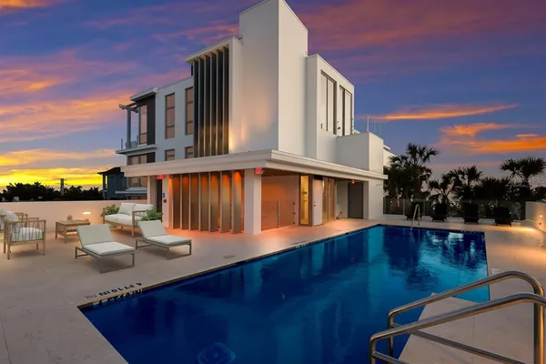 a view of a patio with swimming pool