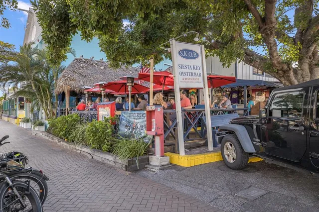 an outdoor view of a building with swimming pool
