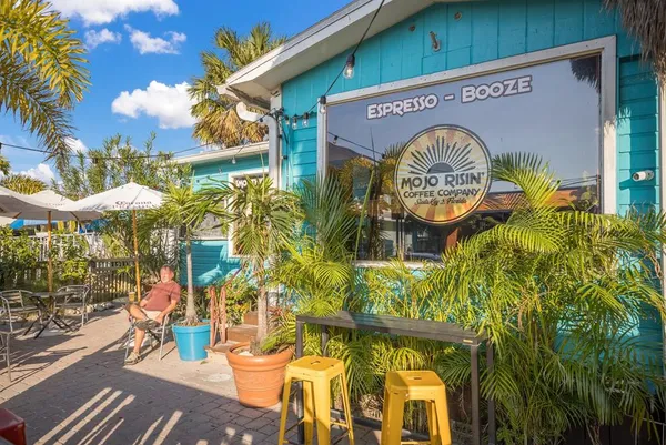 a view of a chairs and tables in patio