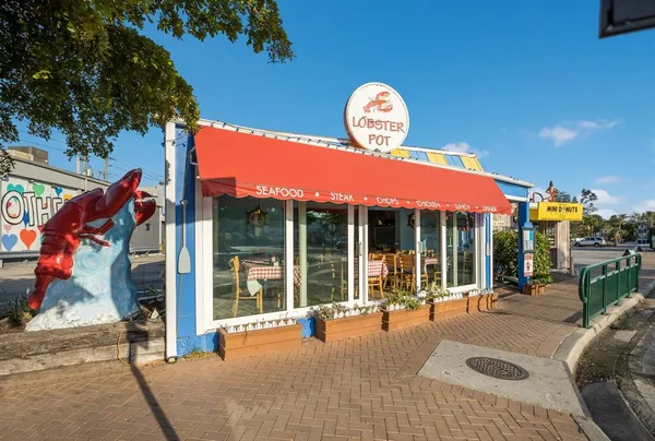 a view of a house with large windows