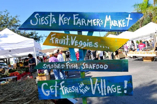 a balcony with wooden floor and fence