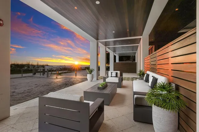 a view of a lake with beach in back