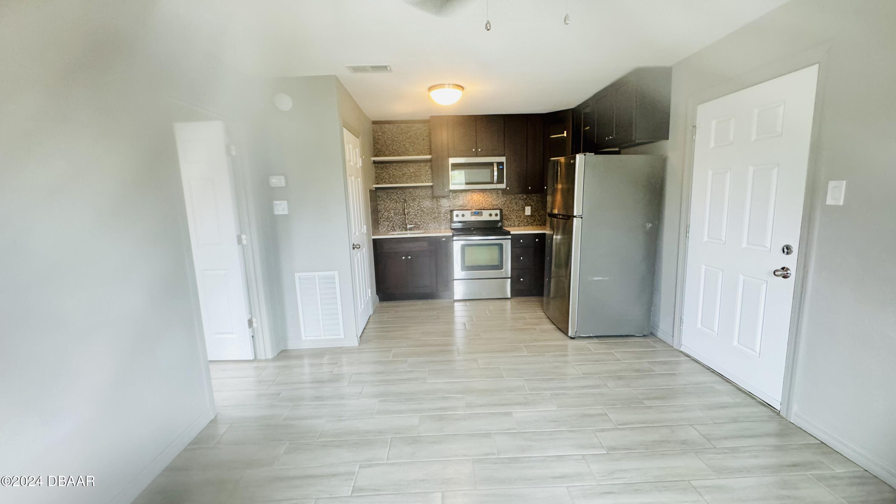 71 Rockefeller Drive, Unit A Ormond Beach, FL 32176 - Photo 9 of 21 IMG_1041