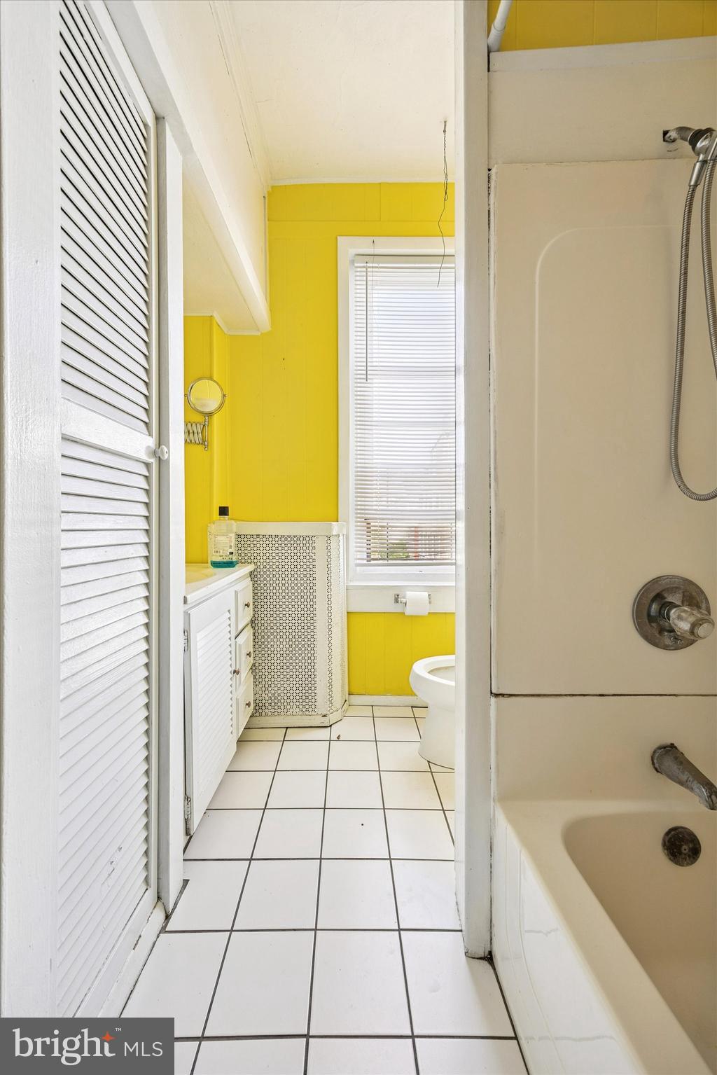 4359 Mitchell Street Philadelphia, PA 19128 - Photo 17 of 23 a bathroom with a tub a sink a mirror and a shower