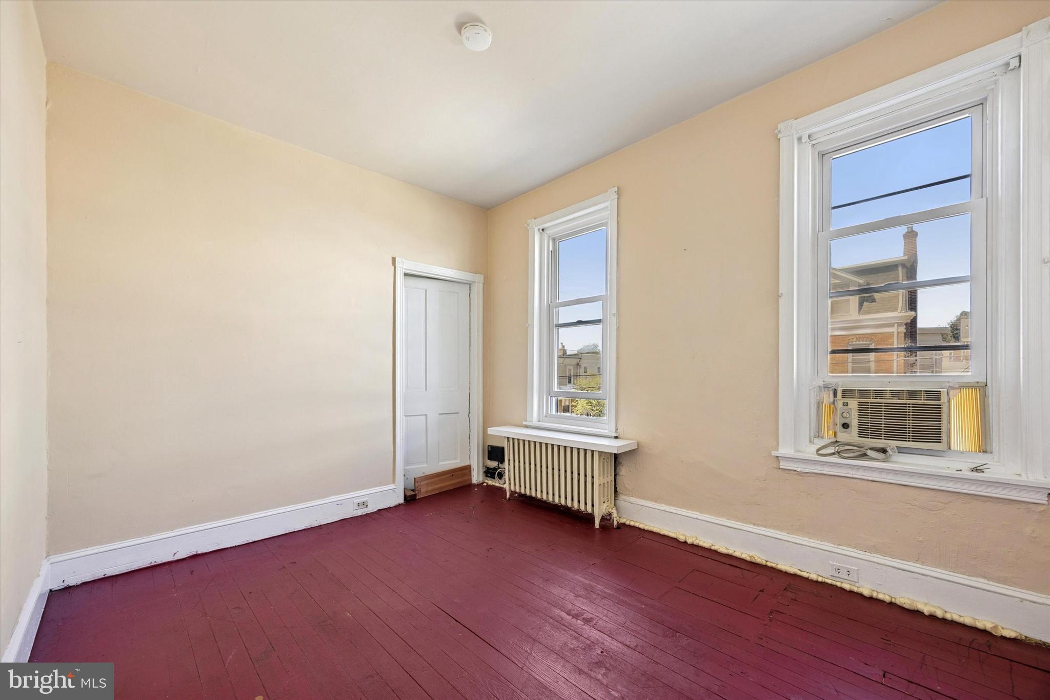 4359 Mitchell Street Philadelphia, PA 19128 - Photo 18 of 23 an empty room with wooden floor and windows