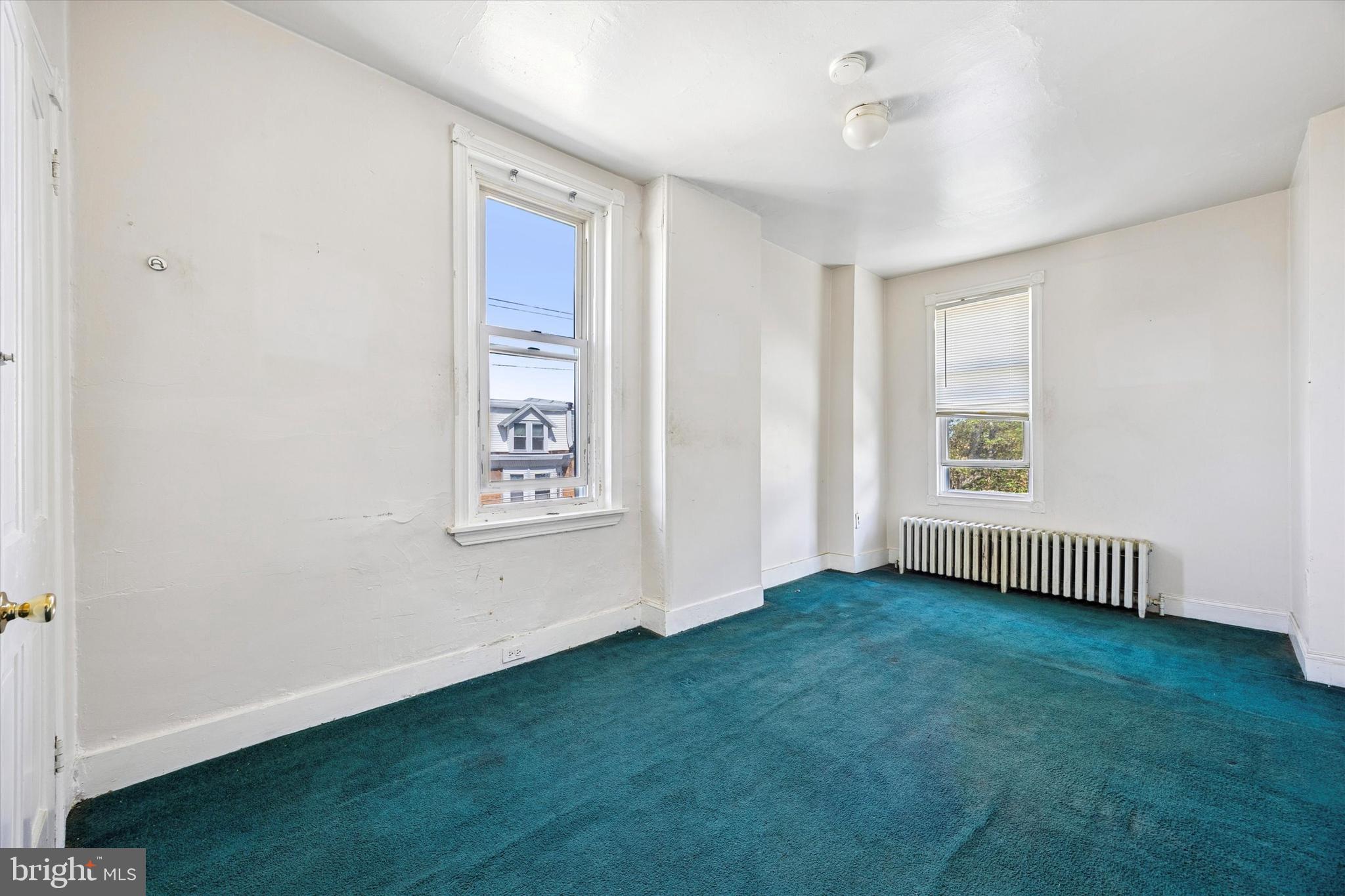 4359 Mitchell Street Philadelphia, PA 19128 - Photo 19 of 23 wooden floor in an empty room with a window