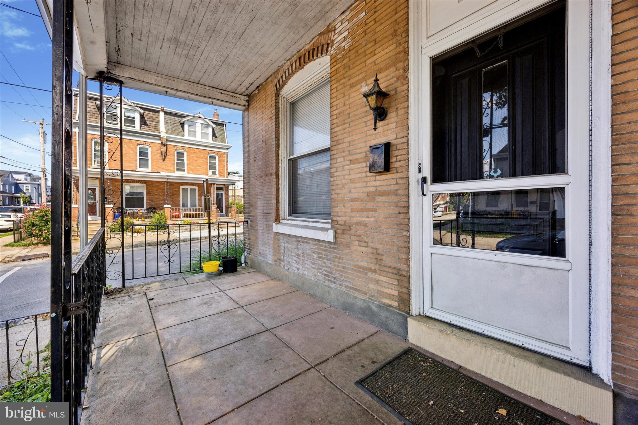 4359 Mitchell Street Philadelphia, PA 19128 - Photo 23 of 23 a view of a brick house with many windows