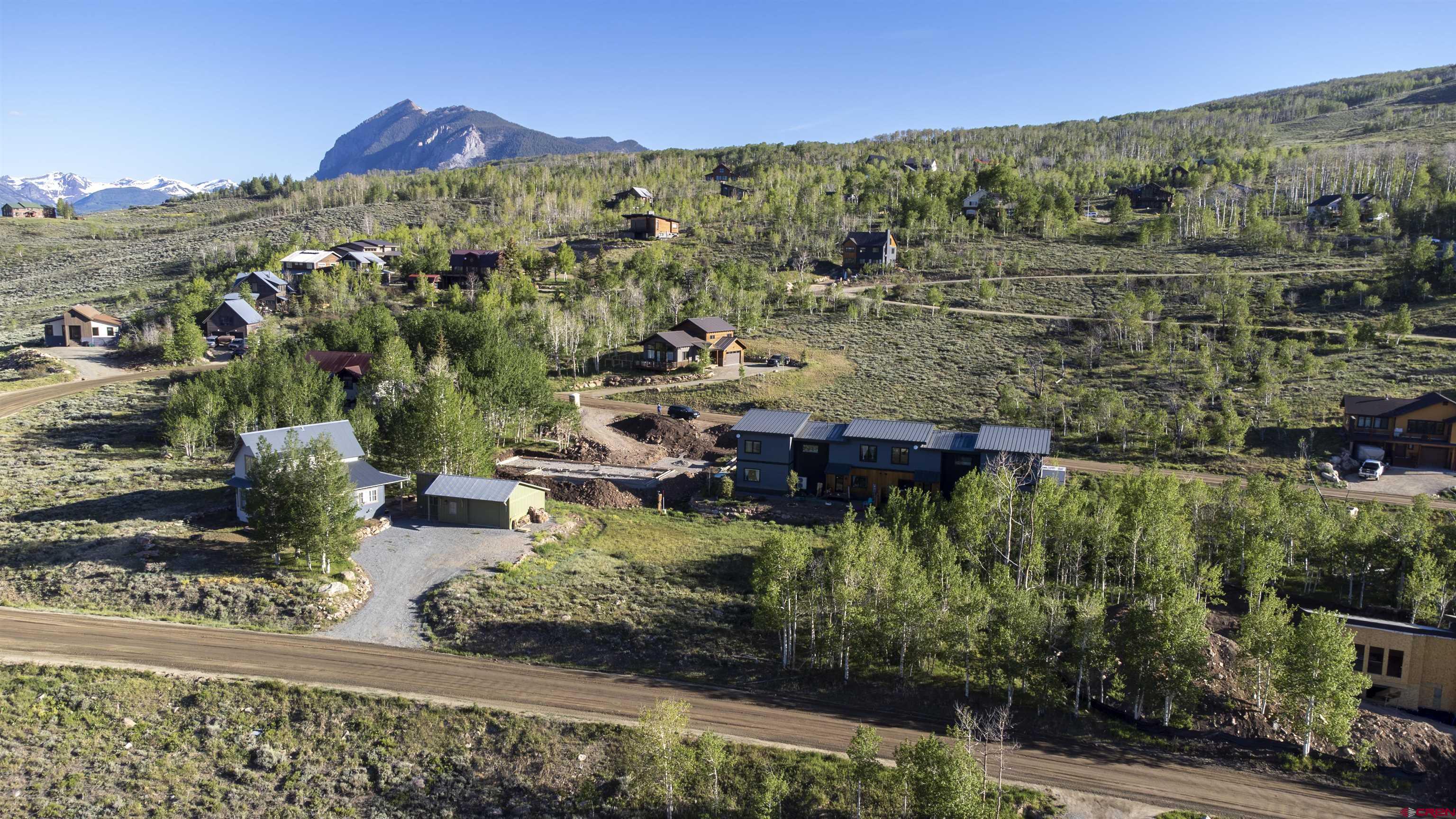451 Zeligman Street Crested Butte, CO 81224 - Photo 2 of 10 a view of a city with mountains in the background