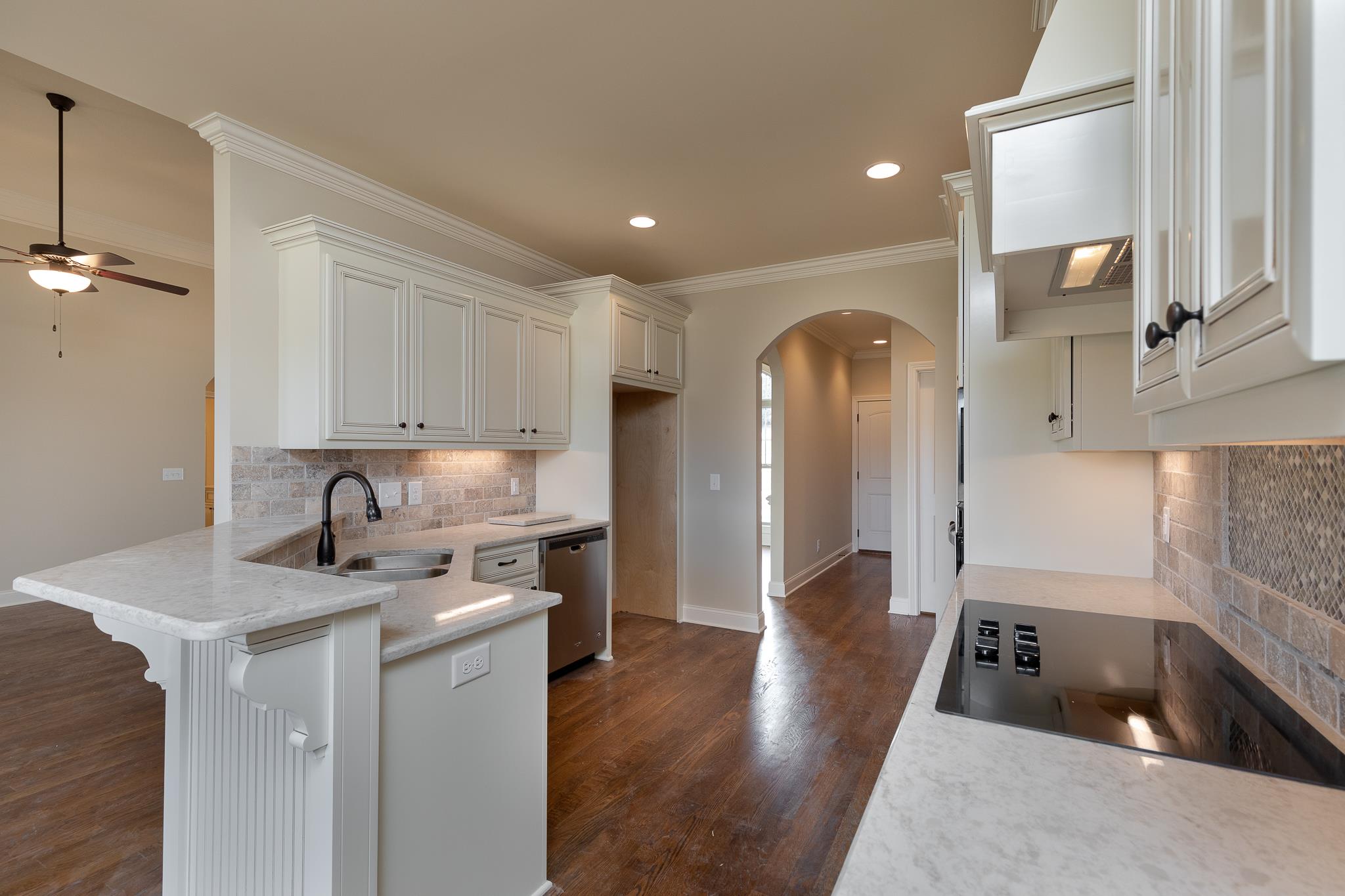 1730 Dillon Road Milton, TN 37118 - Photo 14 of 30 a kitchen with a sink dishwasher a refrigerator and wooden cabinets with wooden floor