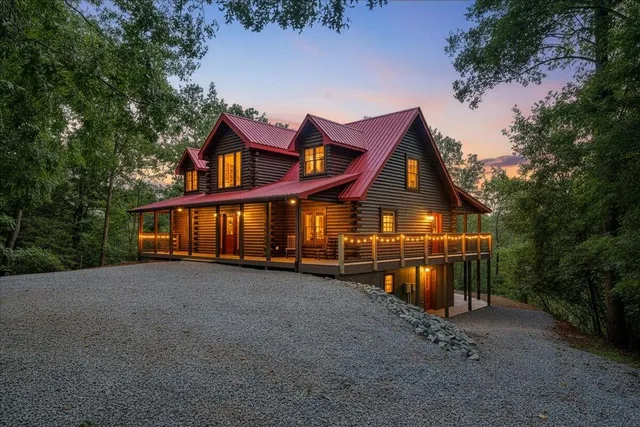 a view of a house with a yard and sitting area