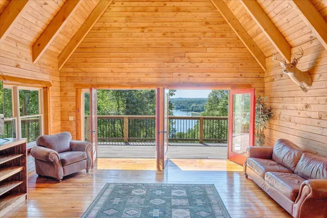 a kitchen with a large window appliances and cabinets