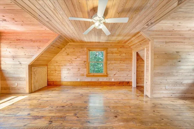a view of a balcony with wooden floor