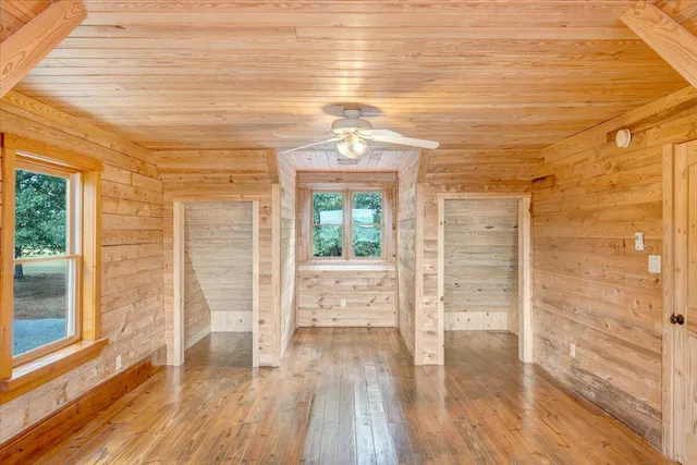 a view of a pathway both side of house