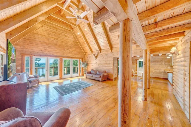 a kitchen with stainless steel appliances granite countertop a stove a sink dishwasher and a stove with wooden floor