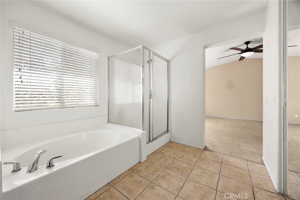 12351 Mesa Grove Drive Riverside, CA 92503 - Photo 14 of 32 a bathroom with a bathtub and a shower