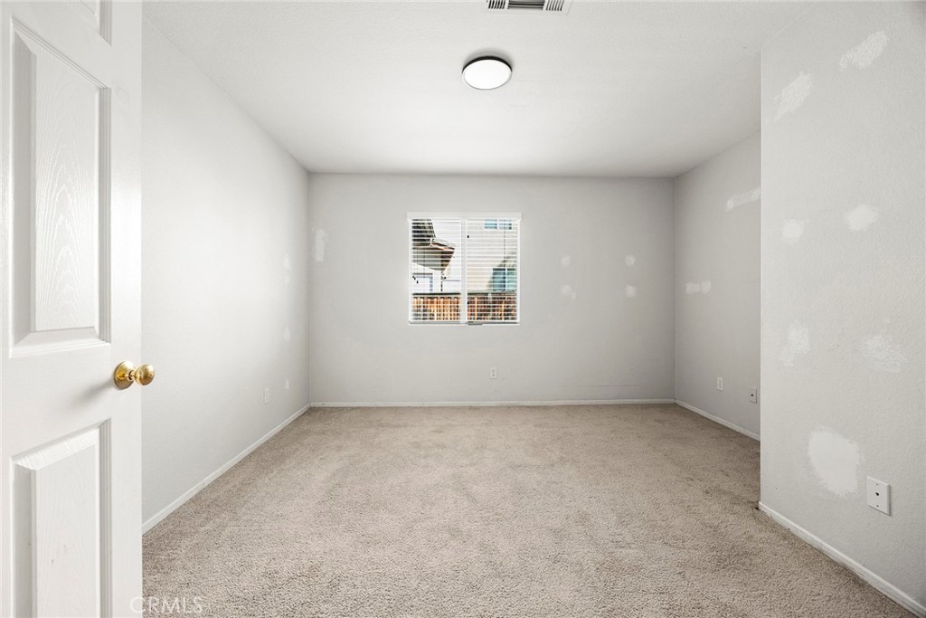 12351 Mesa Grove Drive Riverside, CA 92503 - Photo 16 of 32 an empty room with a window