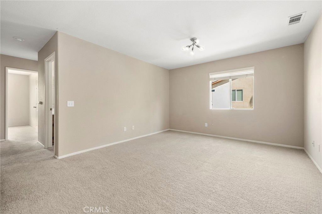 12351 Mesa Grove Drive Riverside, CA 92503 - Photo 18 of 32 an empty room with a empty space and windows