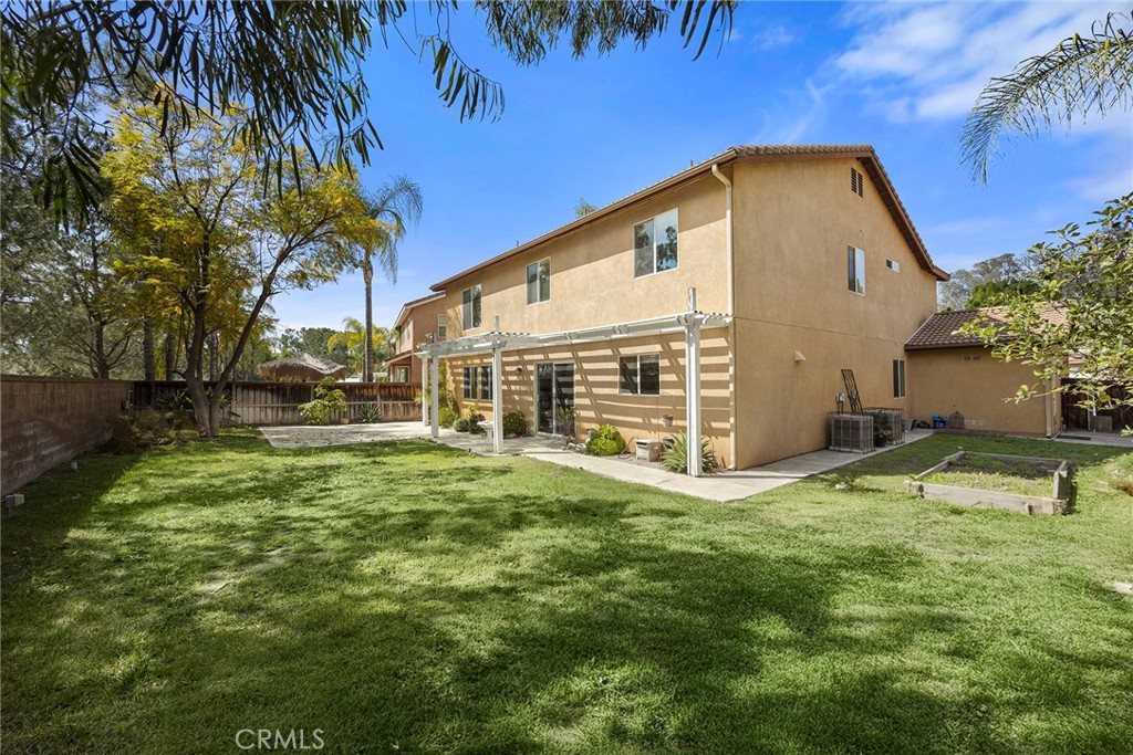 12351 Mesa Grove Drive Riverside, CA 92503 - Photo 22 of 32 a view of a house with a yard