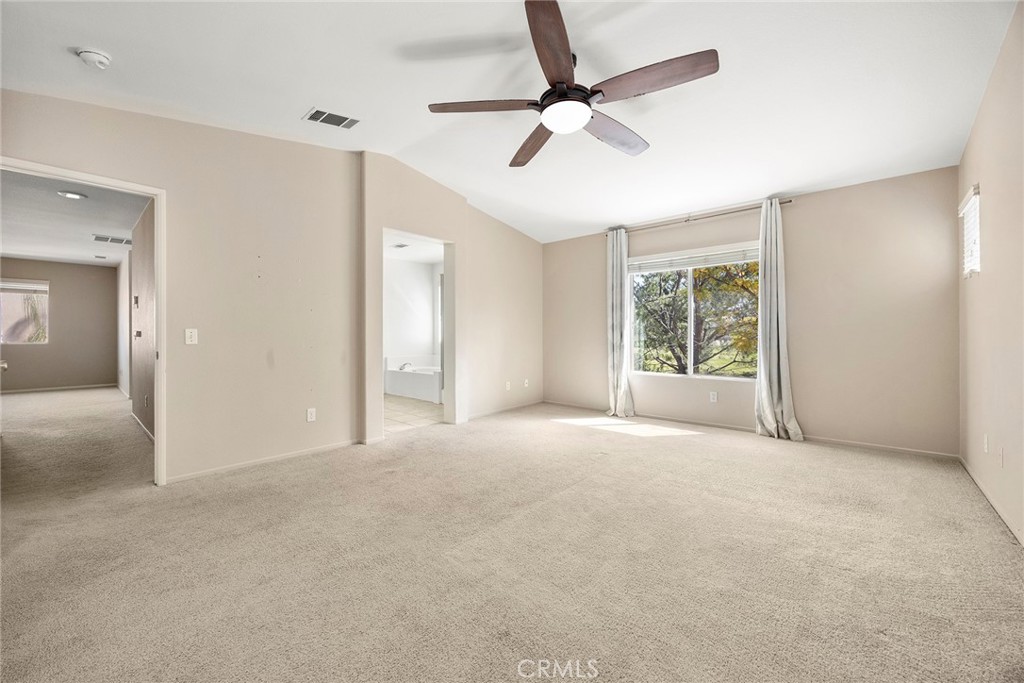 12351 Mesa Grove Drive Riverside, CA 92503 - Photo 25 of 32 an empty room with fan and windows