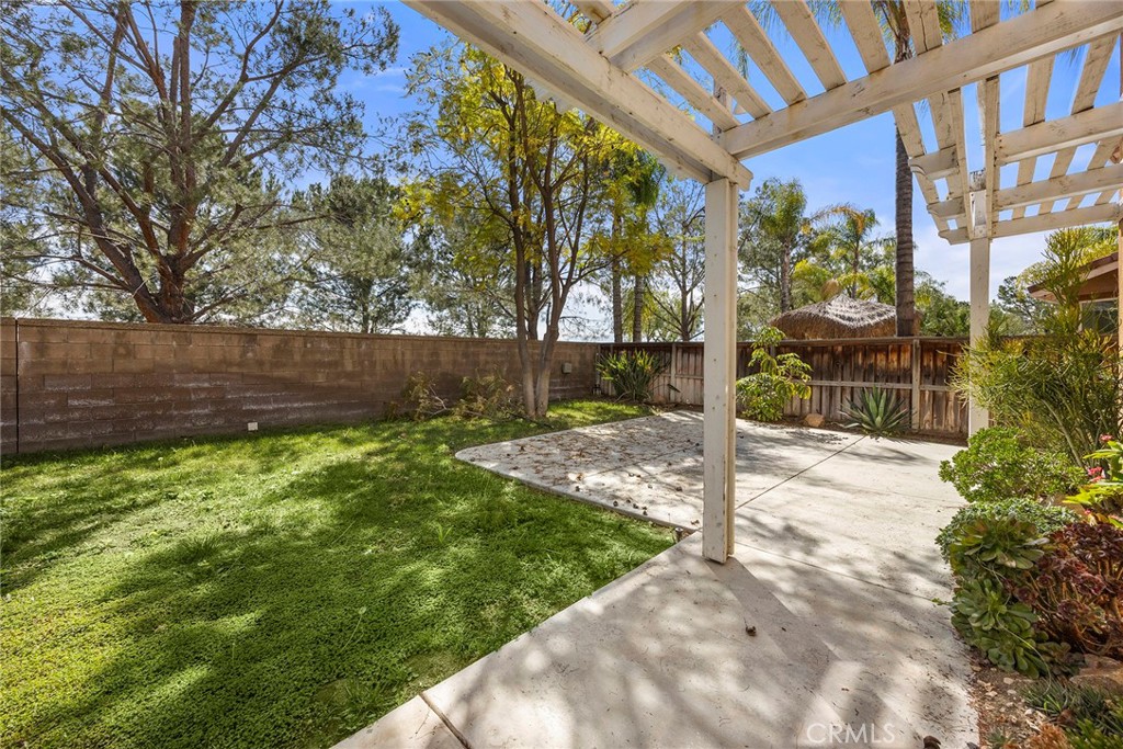 12351 Mesa Grove Drive Riverside, CA 92503 - Photo 26 of 32 a view of a backyard with plants and large trees