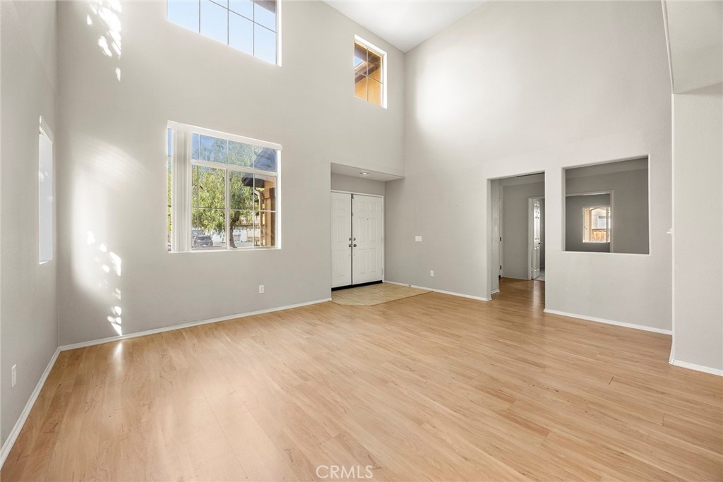 12351 Mesa Grove Drive Riverside, CA 92503 - Photo 4 of 32 a view of an empty room with wooden floor and a window