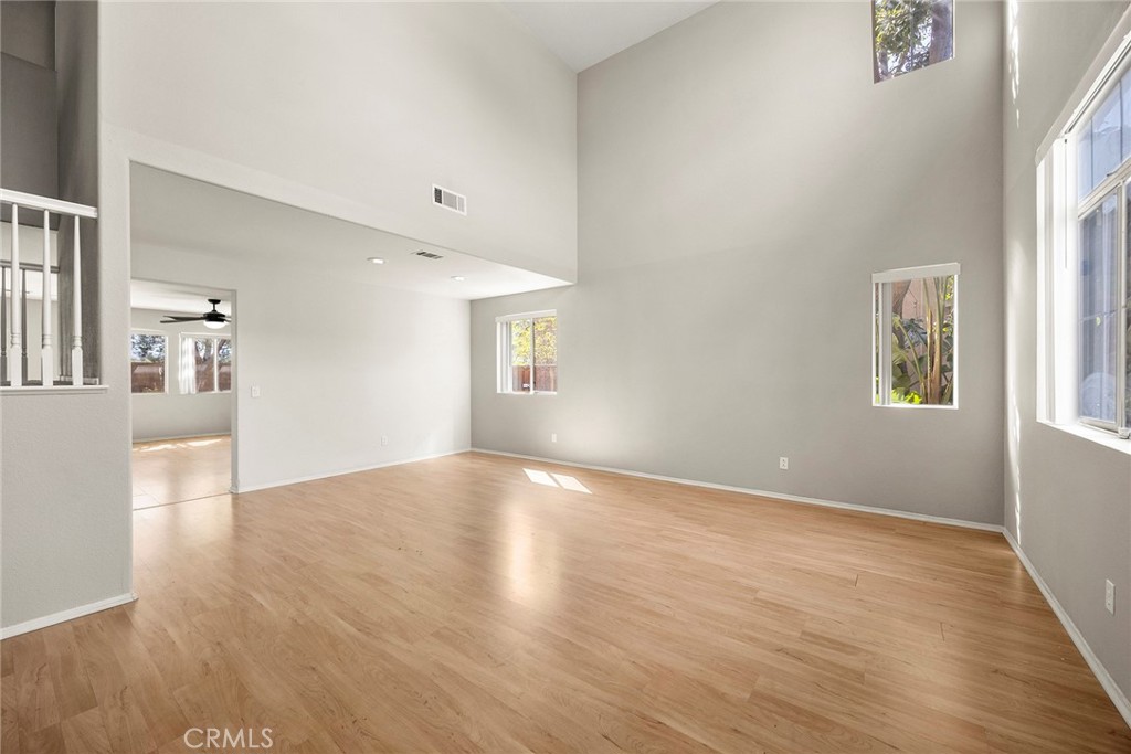 12351 Mesa Grove Drive Riverside, CA 92503 - Photo 5 of 32 an empty room with wooden floor and windows