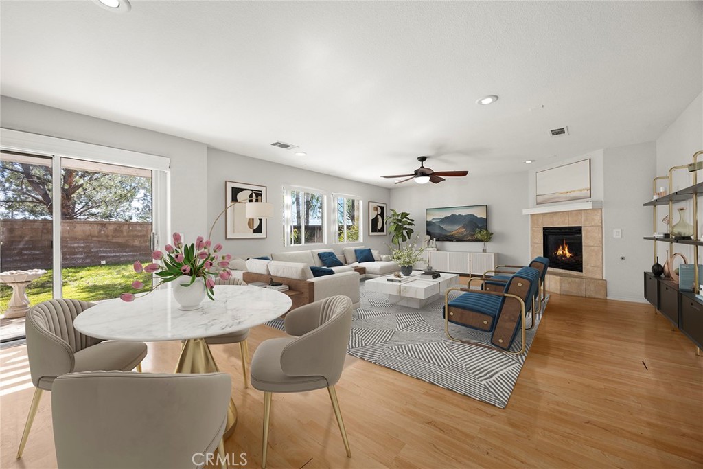 12351 Mesa Grove Drive Riverside, CA 92503 - Photo 6 of 32 a living room with fireplace furniture and a large window