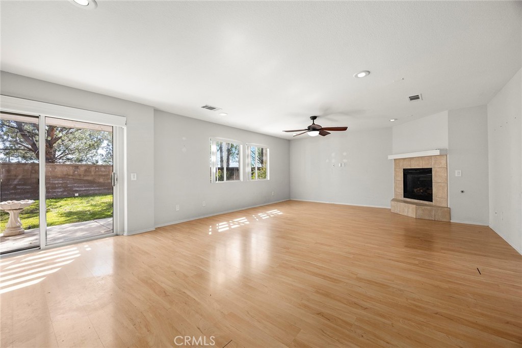 12351 Mesa Grove Drive Riverside, CA 92503 - Photo 7 of 32 a view of empty room with wooden floor and fan