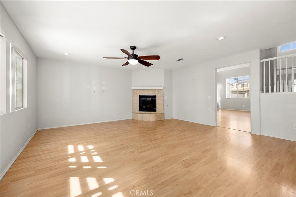 12351 Mesa Grove Drive Riverside, CA 92503 - Photo 8 of 32 a view of an empty room with a window and wooden floor