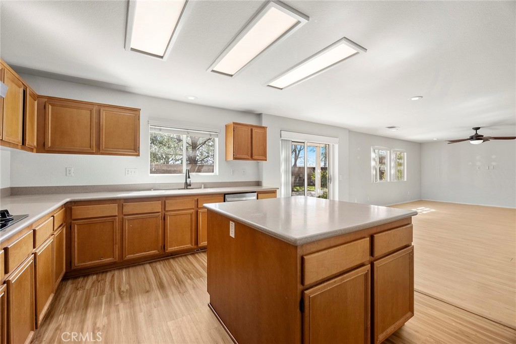 12351 Mesa Grove Drive Riverside, CA 92503 - Photo 9 of 32 a kitchen with sink cabinets and wooden floor