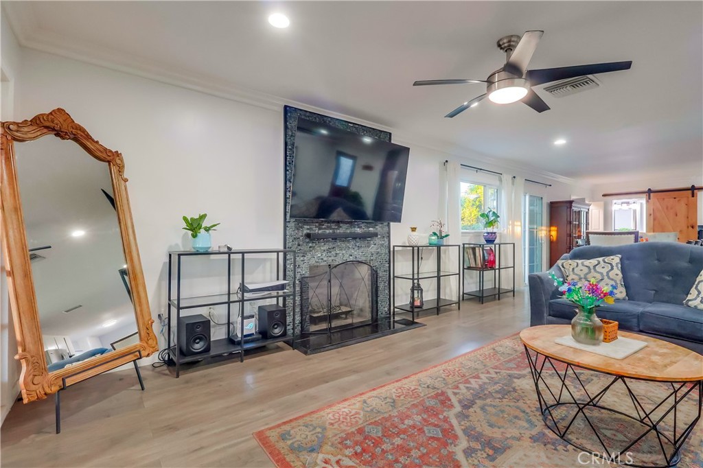 10937 Colima Road Whittier, CA 90604 - Photo 16 of 55 a living room with furniture and a fireplace