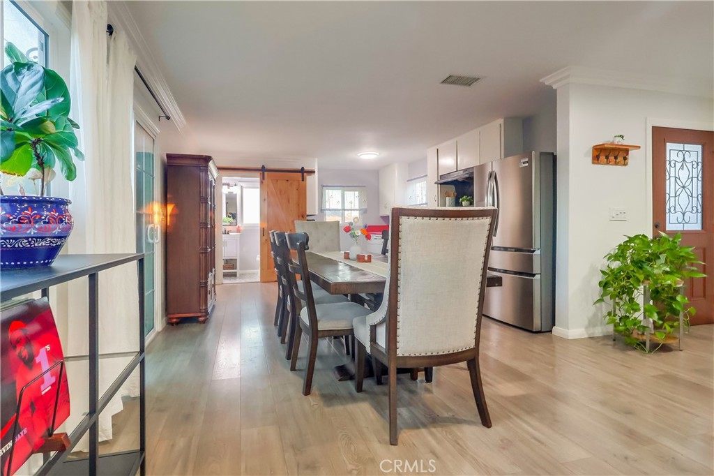 10937 Colima Road Whittier, CA 90604 - Photo 17 of 55 a view of a dining room with furniture and wooden floor