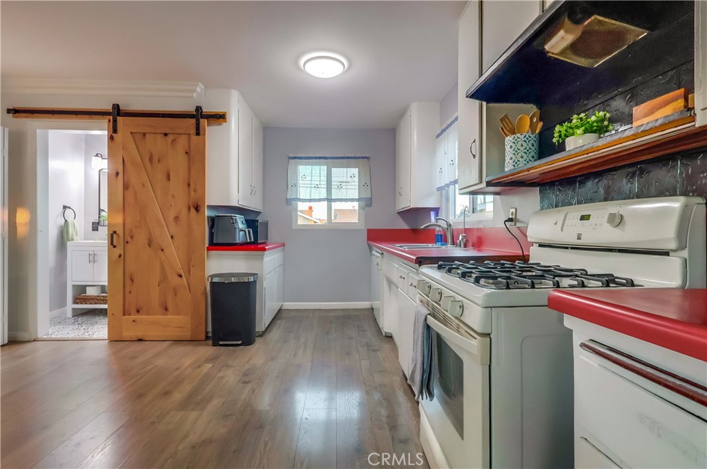 10937 Colima Road Whittier, CA 90604 - Photo 20 of 55 a kitchen with stainless steel appliances granite countertop a stove and a refrigerator