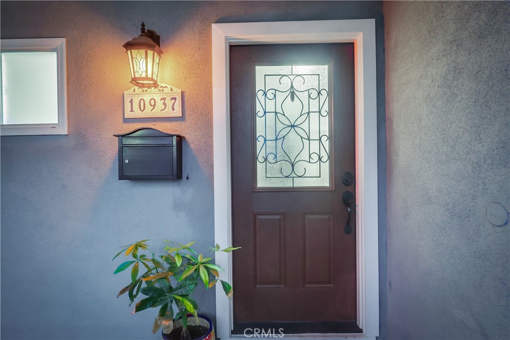 10937 Colima Road Whittier, CA 90604 - Photo 3 of 55 a bathroom with a sink a mirror and a window