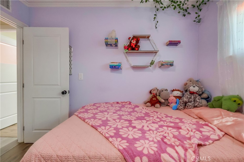 10937 Colima Road Whittier, CA 90604 - Photo 34 of 55 a bedroom with a bed and a window