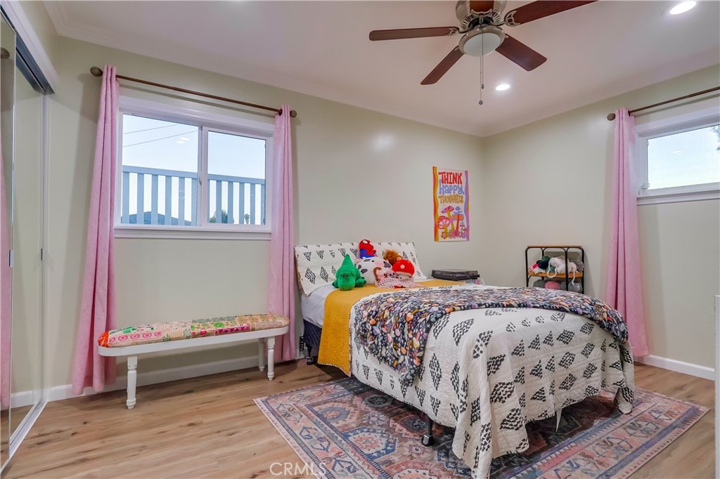 10937 Colima Road Whittier, CA 90604 - Photo 35 of 55 a bedroom with a bed table and window
