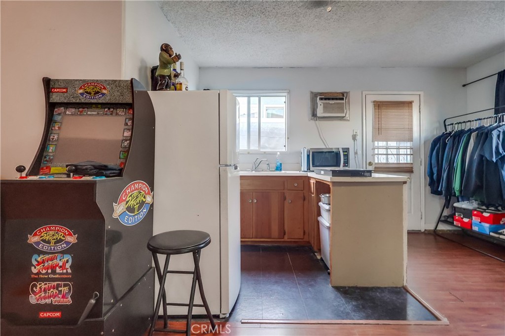 10937 Colima Road Whittier, CA 90604 - Photo 42 of 55 a view of kitchen with stainless steel appliances granite countertop a refrigerator and a stove top oven