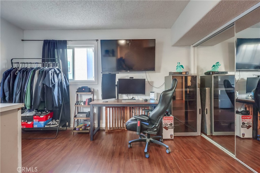 10937 Colima Road Whittier, CA 90604 - Photo 44 of 55 a living room with furniture and a flat screen tv