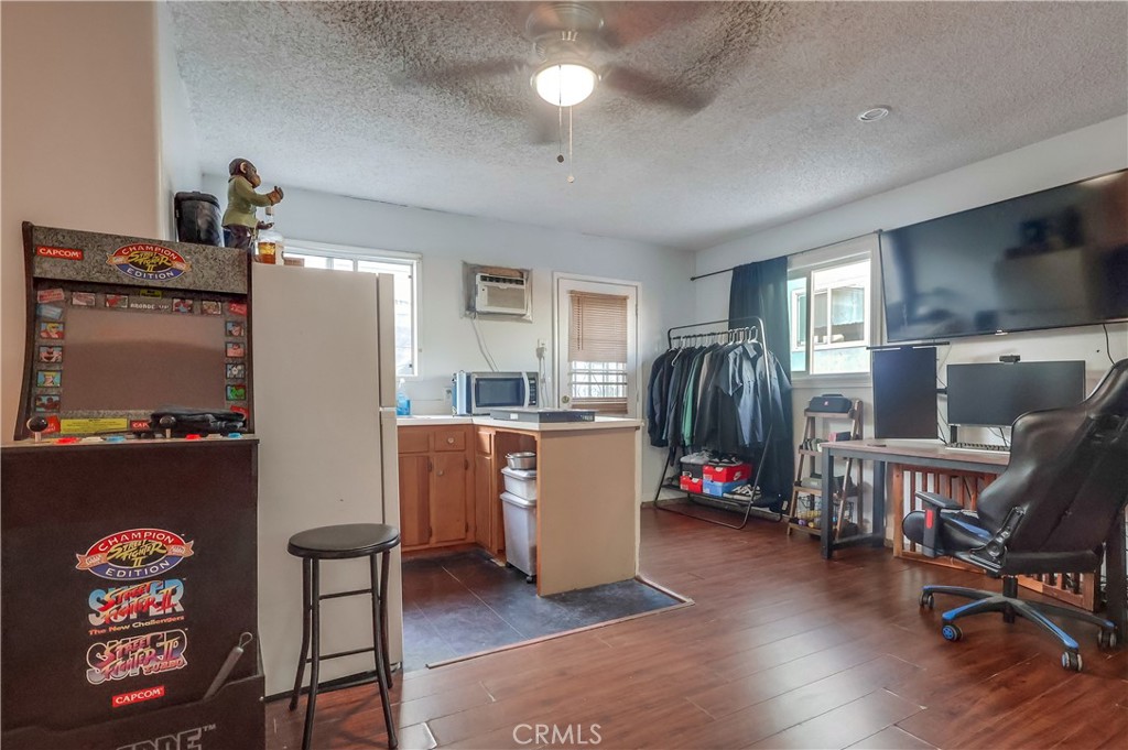 10937 Colima Road Whittier, CA 90604 - Photo 45 of 55 a room with furniture and a flat screen tv