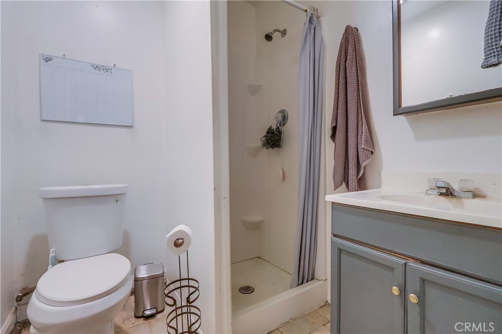 10937 Colima Road Whittier, CA 90604 - Photo 48 of 55 a bathroom with a shower a toilet and a sink