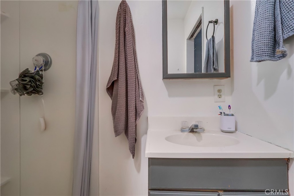 10937 Colima Road Whittier, CA 90604 - Photo 49 of 55 a bathroom with a sink and a mirror