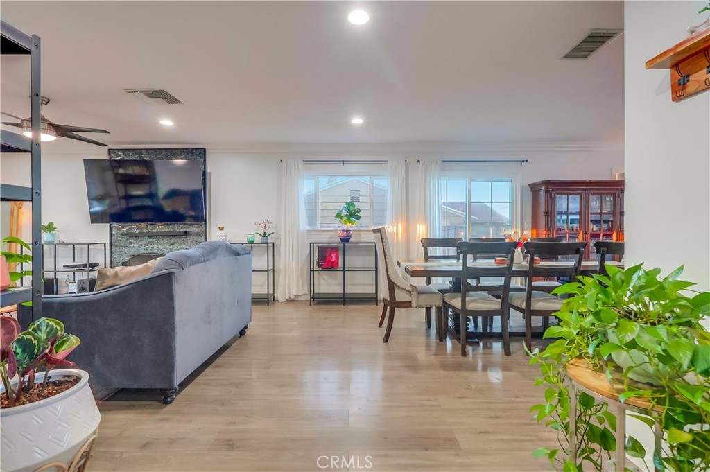 10937 Colima Road Whittier, CA 90604 - Photo 10 of 55 a large open kitchen with a table and chairs in it