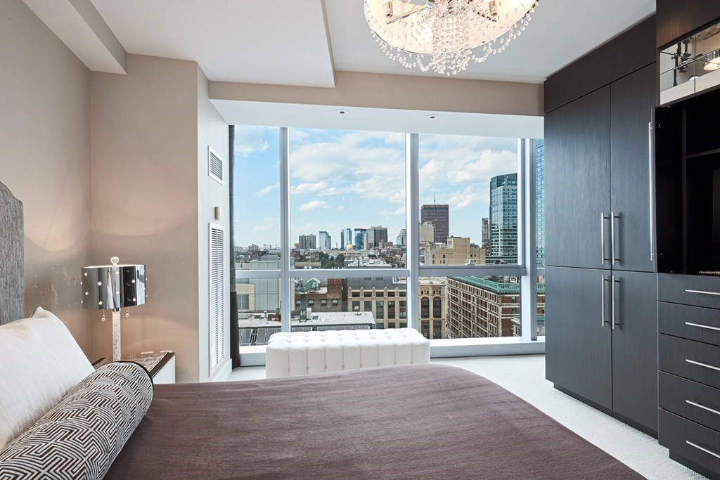 110 Stuart Street, Unit 18G Boston, MA 02116 - Photo 11 of 21 a living room with furniture and a large window