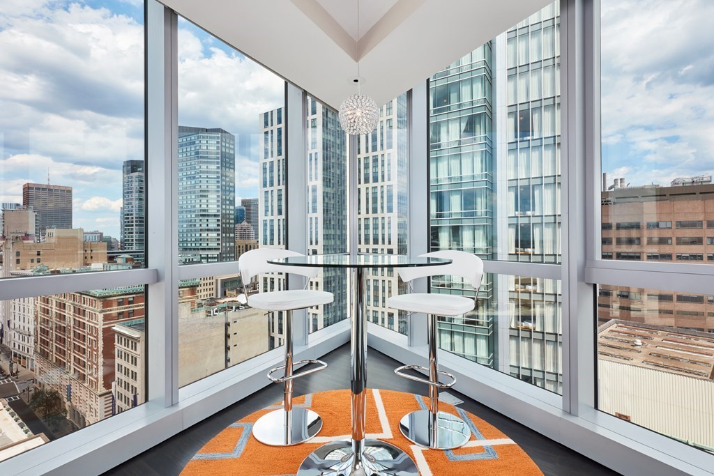 110 Stuart Street, Unit 18G Boston, MA 02116 - Photo 2 of 21 a view of a kitchen with furniture and floor to ceiling windows