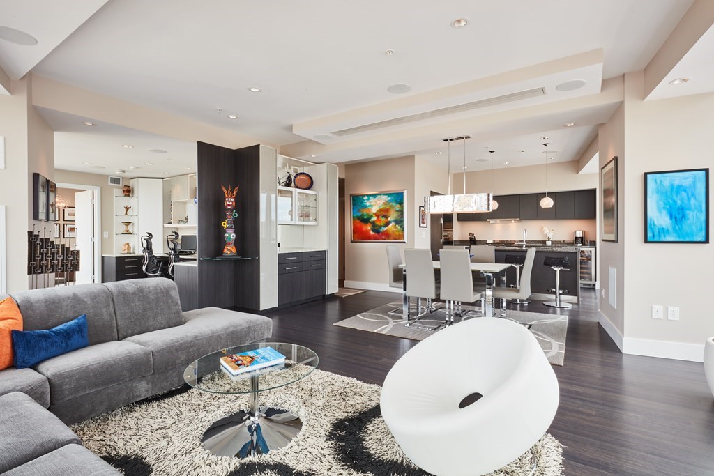 110 Stuart Street, Unit 18G Boston, MA 02116 - Photo 3 of 21 a living room with furniture and kitchen view