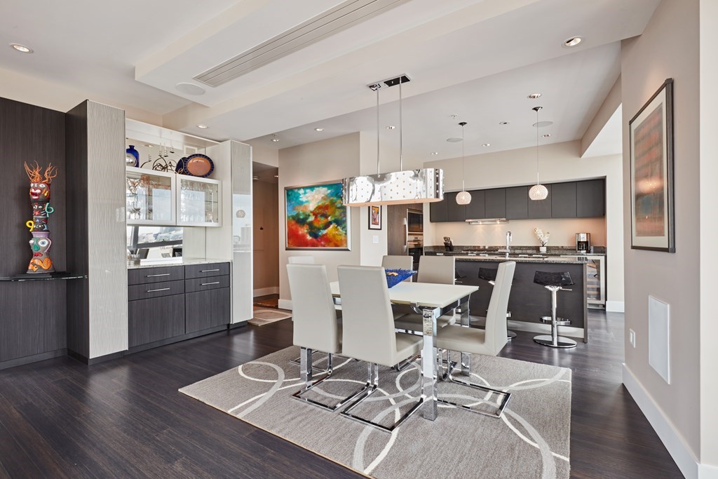 110 Stuart Street, Unit 18G Boston, MA 02116 - Photo 5 of 21 a living room with furniture and kitchen view